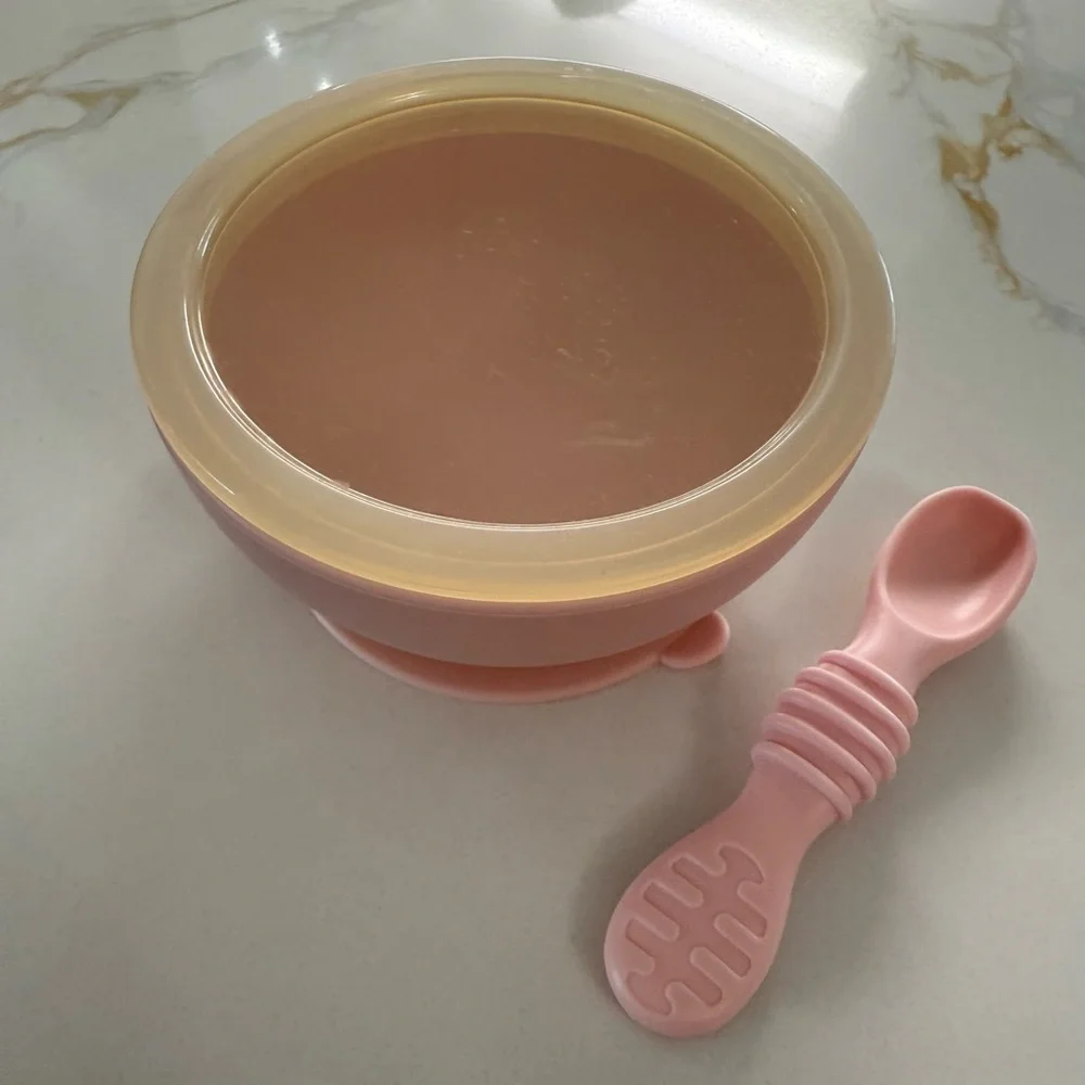 Three Silicone Baby Plates and one Pink Bib